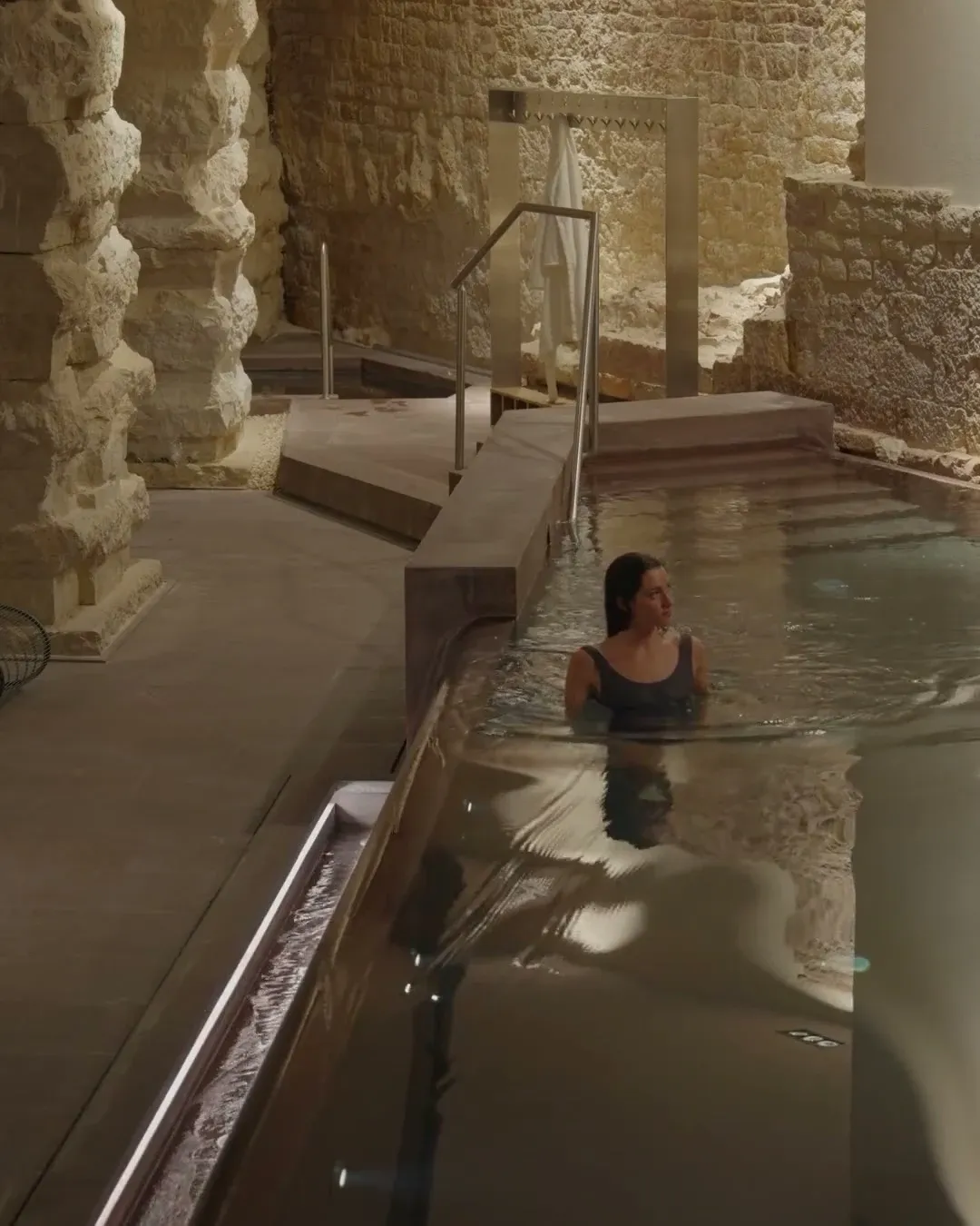 Spa Romana wider angle of pool with woman (video)